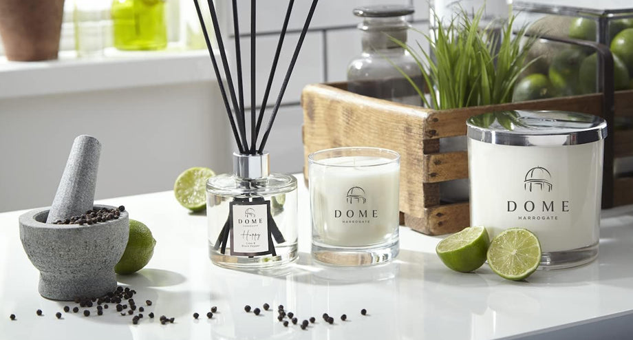 A home fragrance set from DOME Handmade, including a reed diffuser and two scented candles.